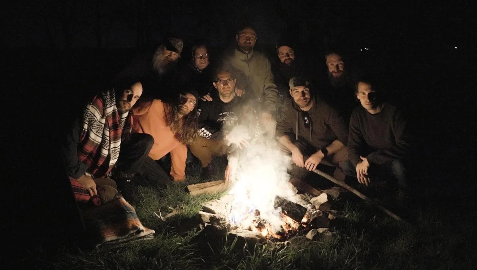 Men gathered around a campfire